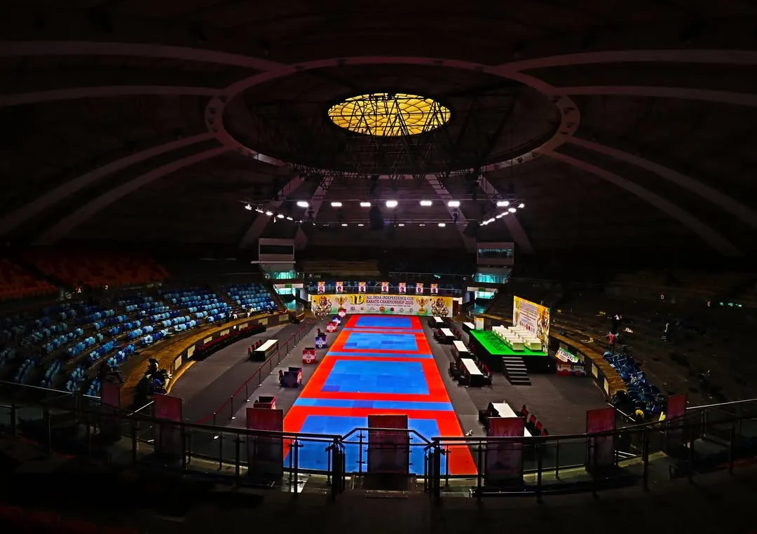 The calm before the storm. The world-class Talkatora Indoor Stadium in New Delhi, fully prepared for the 19th All India Independence Cup Karate Championship, where India's best compete.