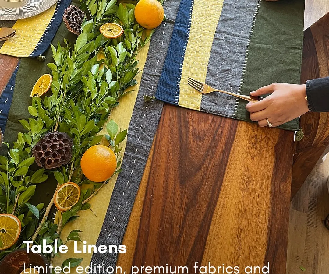 I design my table linens for people who love to host and create memories. This handcrafted table runner, made from earthy khadi linen, brings a touch of nature to your dining space. The combination of color blocking and delicate stitching makes any meal, from a festive dinner to a simple cup of tea, feel special.
