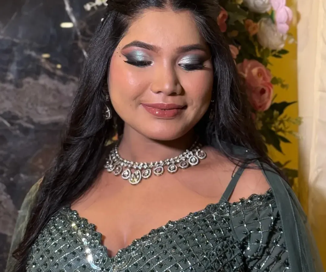 This is what full glam is all about. I created a dramatic silver and black smokey eye, paired with a glossy nude lip to balance the look, perfect for a sangeet or cocktail night.