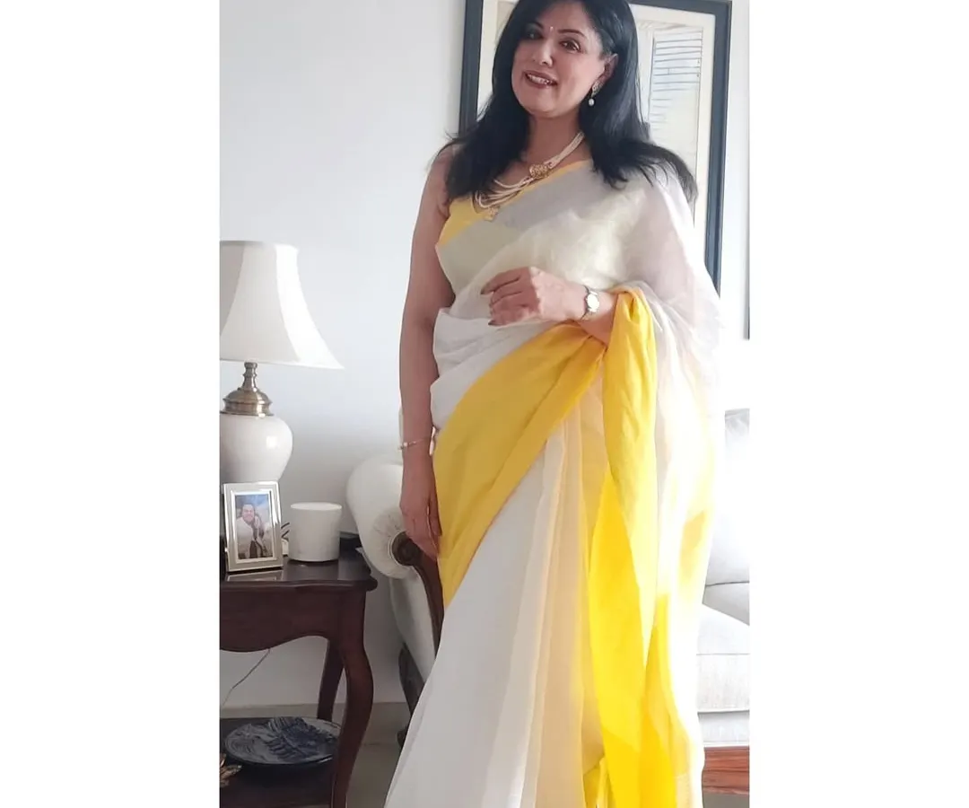 There's nothing like the feel of a light linen saree on a warm day. For a lunch out with my favourites, I wore this white and yellow linen saree with my mother's classic pearls. It’s a perfect example of effortless elegance that doesn't compromise on comfort.