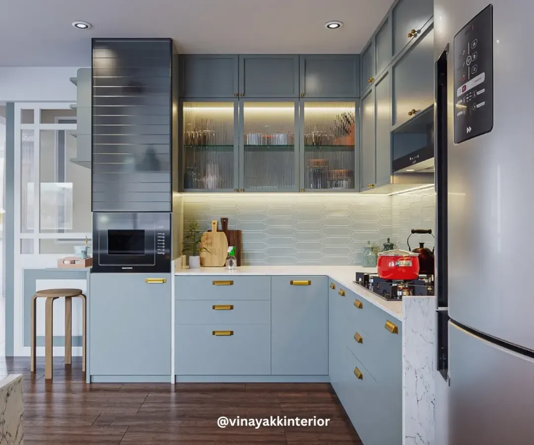The heart of the home deserves to be both beautiful and functional. We designed this modular kitchen with calming powder-blue cabinets, warm under-cabinet lighting, and smart storage solutions to make daily routines feel effortless and stylish.