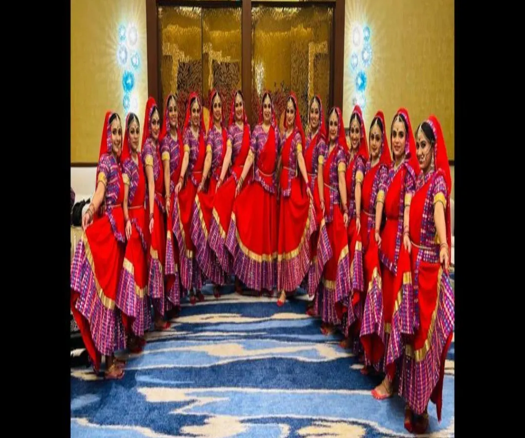 For group performances, I offer matching sets of traditional dance costumes like these vibrant red Ghoomar dresses. Each outfit is designed for visual impact and comfort, making your team's performance unforgettable.