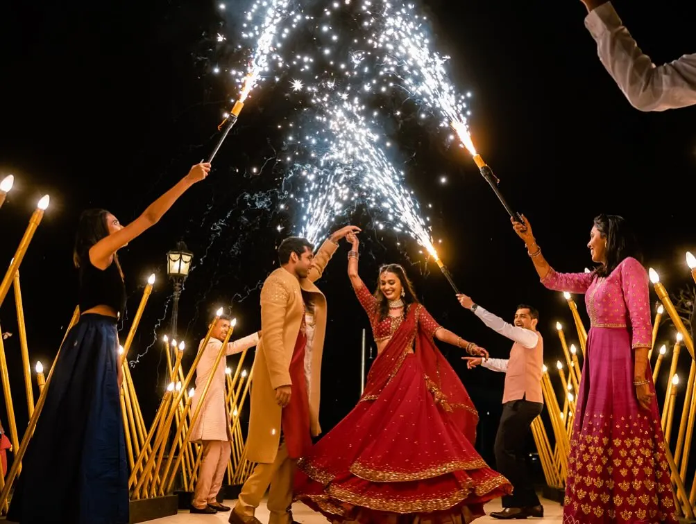 We love creating grand entrances that are full of energy and love. For Aeshna and Anirudh's beach wedding in Goa, we lined the aisle with their friends holding sparklers, creating a dazzling pathway as the couple danced their way into their new beginning.