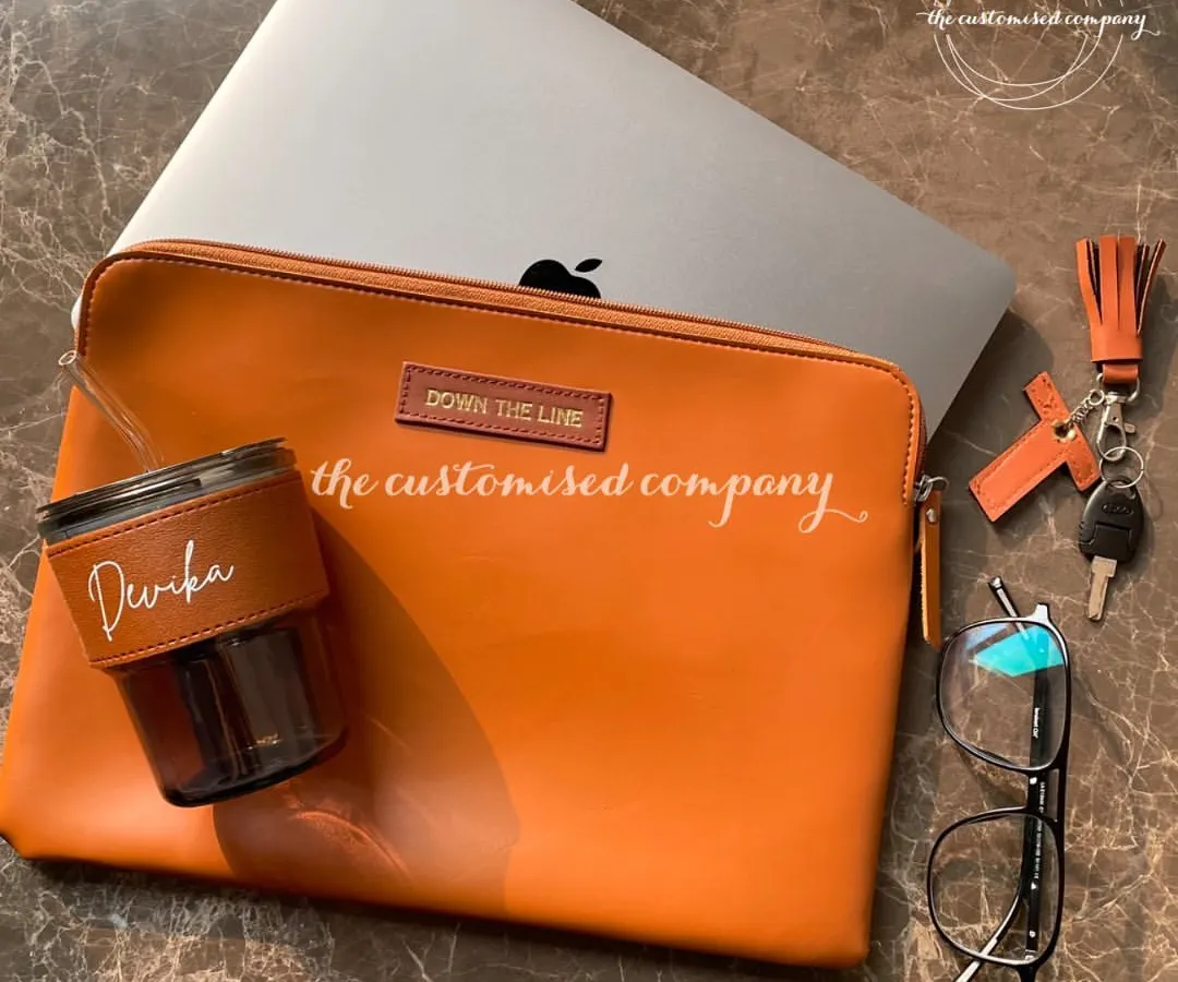 This is a perfect example of a premium employee welcome kit. The set includes a personalized laptop sleeve, a custom-engraved sipper, and a matching keychain, all designed to create a cohesive and impressive brand experience from day one.