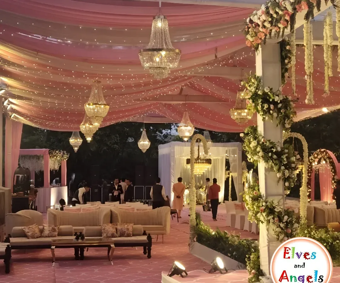 I transformed this large venue into a dreamy wonderland for a Sangeet night. By draping the ceiling with soft pink fabric and weaving in thousands of fairy lights, I created a magical canopy. Crystal chandeliers added a touch of grandeur, setting a romantic and celebratory mood for an evening of dance and music.