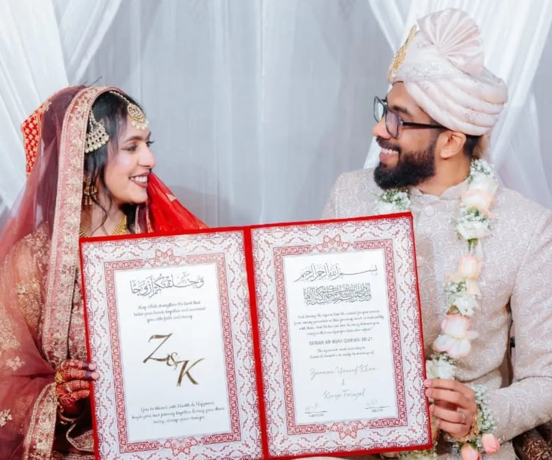The joy on their faces says everything. Here, the happy couple holds their personalized Nikah nama, beautifully presented in a velvet folder. This isn't just a document; it's the first heirloom of their new family.
