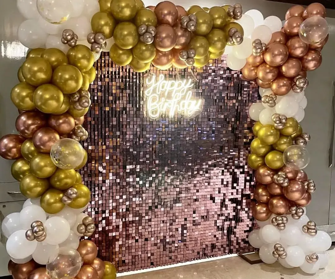 This is one of my most requested designs for parties. It features a shimmering rose gold sequin wall that catches the light beautifully, framed by a balloon arch in metallic gold, rose gold, and white. The 'Happy Birthday' neon sign adds a celebratory glow, creating a perfect photo booth for any event.