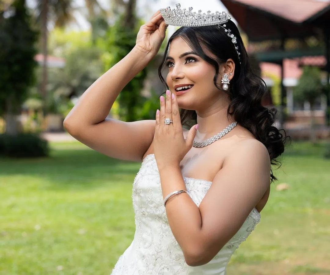 Capturing the pure joy of a bride-to-be. This classic white Christian bridal gown features beautiful subtle embroidery and a timeless silhouette. Paired with one of my sparkling tiaras, it creates an ethereal and unforgettable wedding day look.