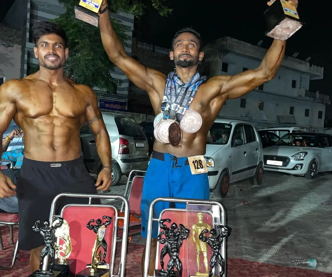 Results speak louder than words. Here is my student celebrating his win after months of brutal discipline and training. We don't just train to look good; we train to be champions on stage.