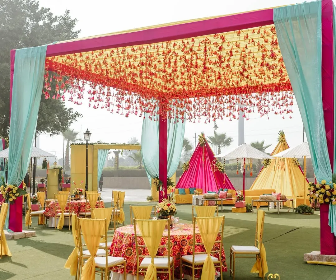 We believe in celebrations that are bursting with life and color. This poolside Haldi setup, with its vibrant canopies, traditional manji lounges, and phulkari details, shows how we infuse energy and joy into pre-wedding festivities.