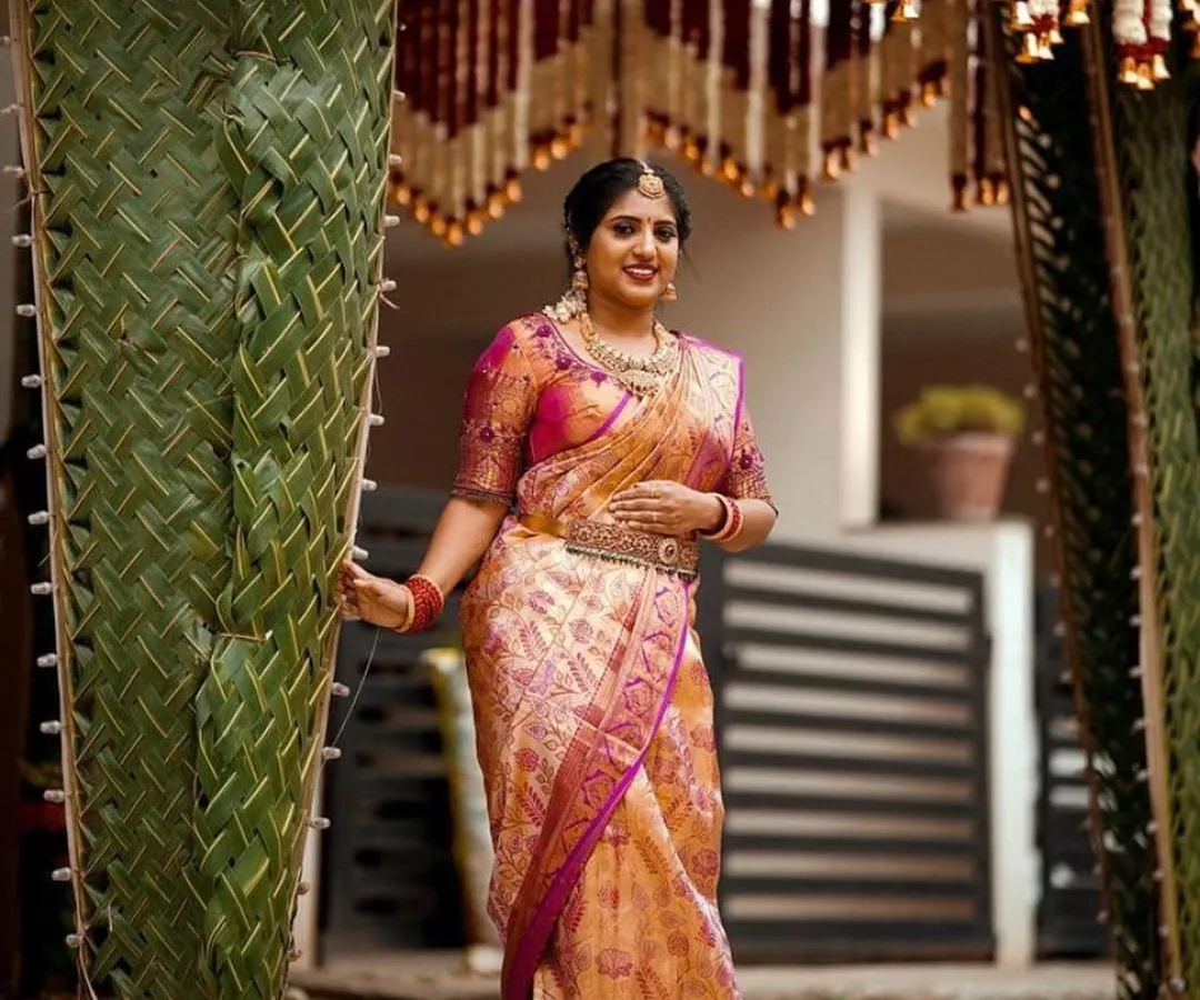 This is a traditional South Indian `Chapara` or welcome arch. We crafted this beautiful entrance using fresh, hand-woven coconut leaves and floral hangings for an authentic and auspicious start to the wedding ceremony.