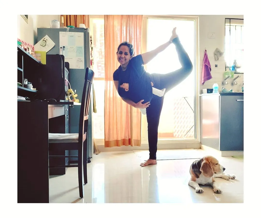 Here I am, finding a moment for a Dancer's Pose in my living room, with my two babies nearby. This is what real-life practice looks like for a mom. My online classes are designed to fit into your world, helping you find that essential 'me time' and strength amidst the beautiful chaos of motherhood.