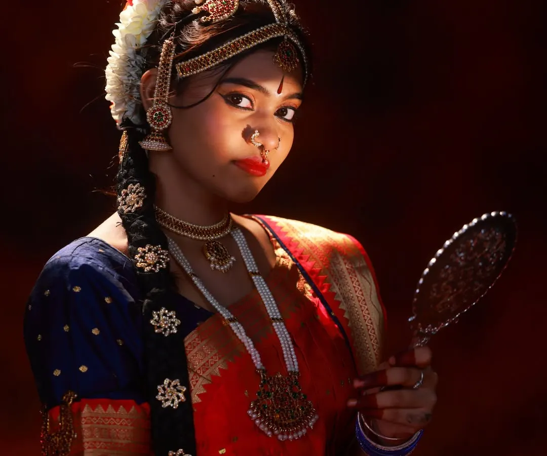 I love capturing the details. This close up highlights the abhinaya, or facial expression, which is the soul of classical dance. The lighting focuses on the intricate temple jewellery and traditional hair styling.