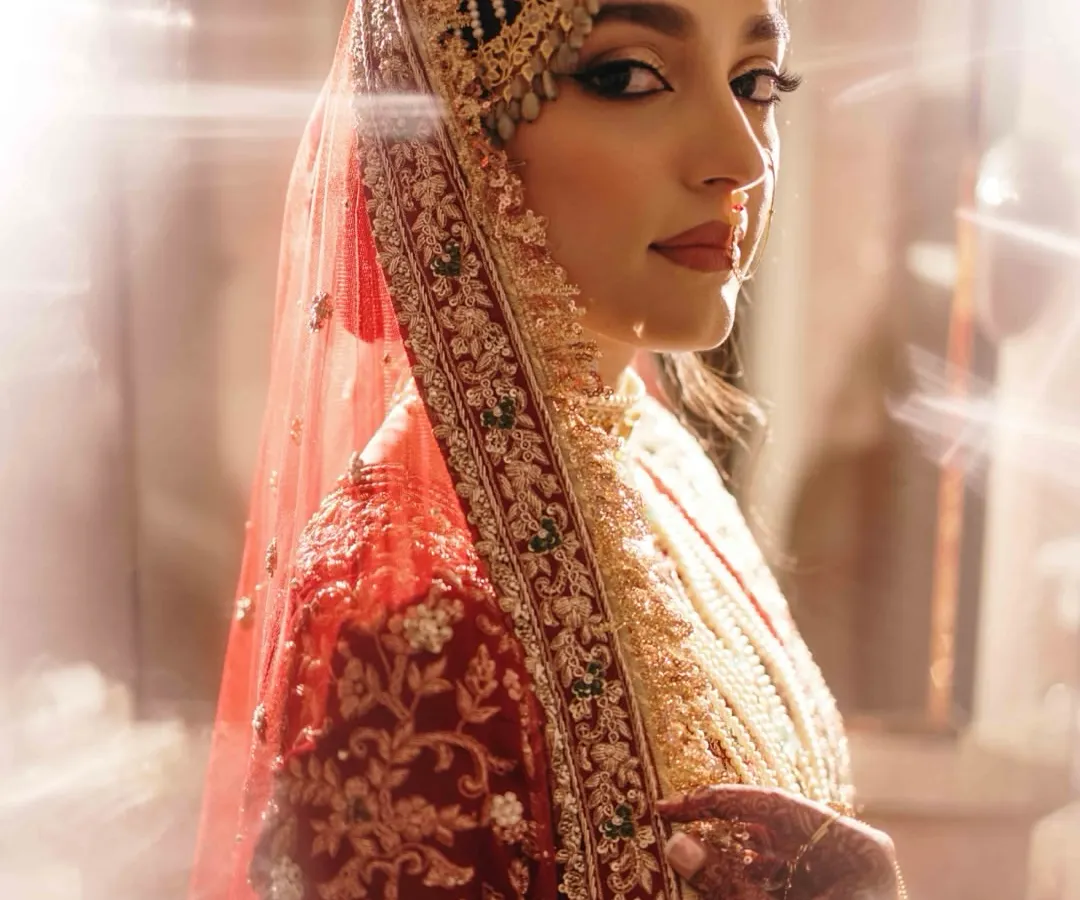 A bridal portrait is more than a photograph; it's a timeless piece of art. We use light and shadow to create a sense of drama and elegance, ensuring the bride's grace and personality shine through in a truly regal portrait.