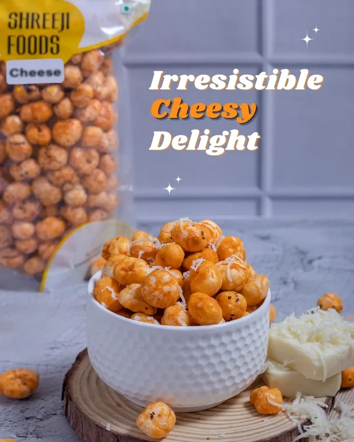 If you love cheese, you will love this. My Cheesy Makhana is the perfect guilt-free snack for your late-night cravings. This shot shows a full bowl of cheese-flavored fox nuts, with the packet and fresh cheese in the background.