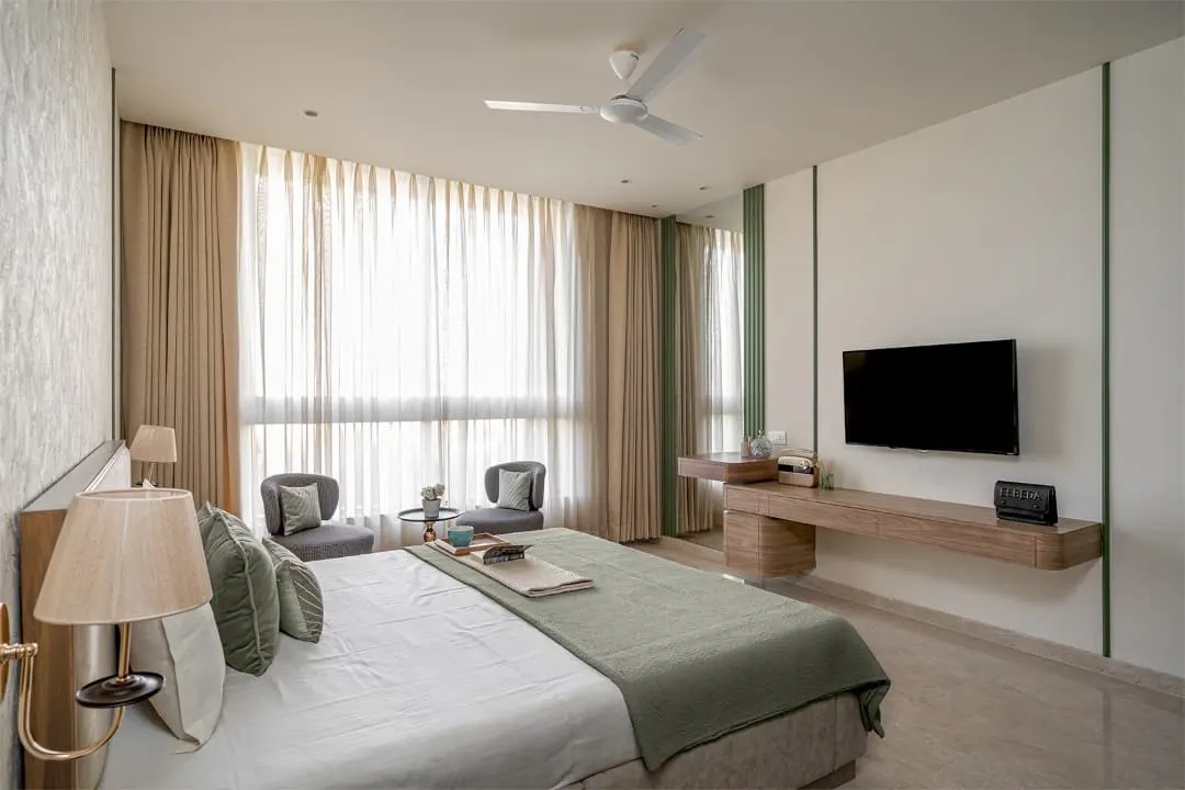 I built this entire master bedroom set to create a calm and sophisticated retreat. The project included the faux leather-clad bed, the floating TV console, and the pair of houndstooth-patterned chairs by the window. It shows how I deliver a complete, cohesive furniture solution for a room.