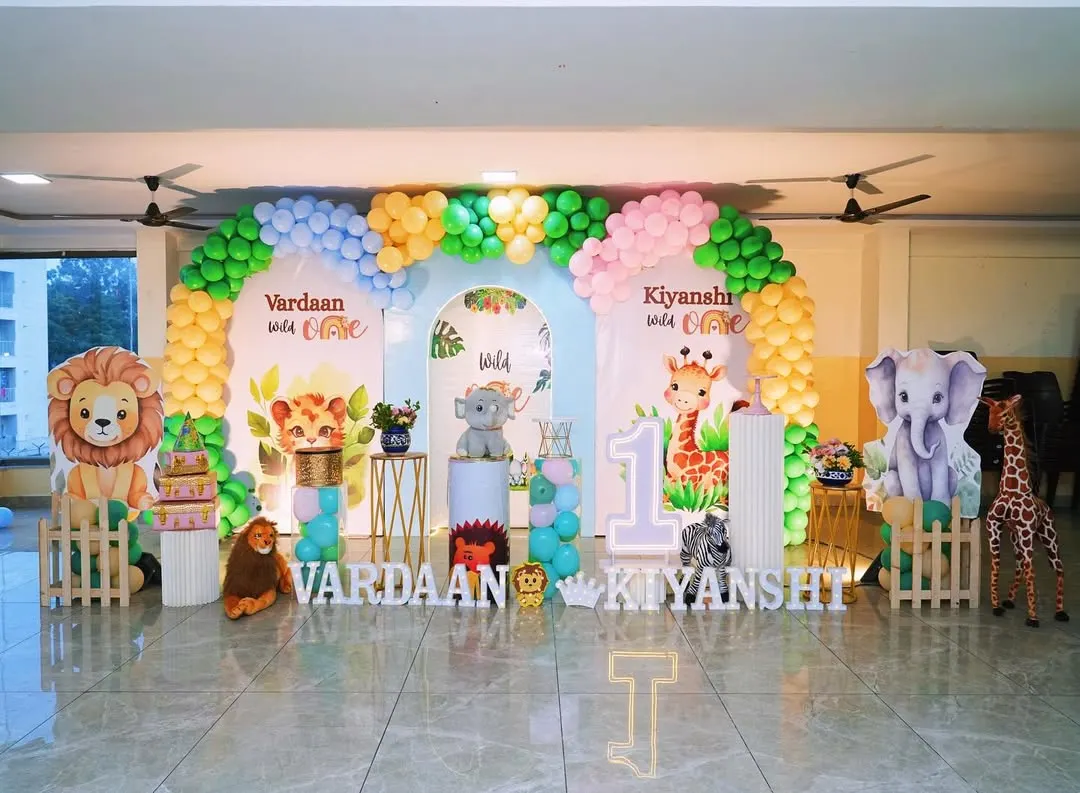 I designed this vibrant jungle theme for a set of twins, showing how I can create a large, cohesive look for any celebration. The setup includes personalized backdrops for each child and plenty of friendly animal cutouts.