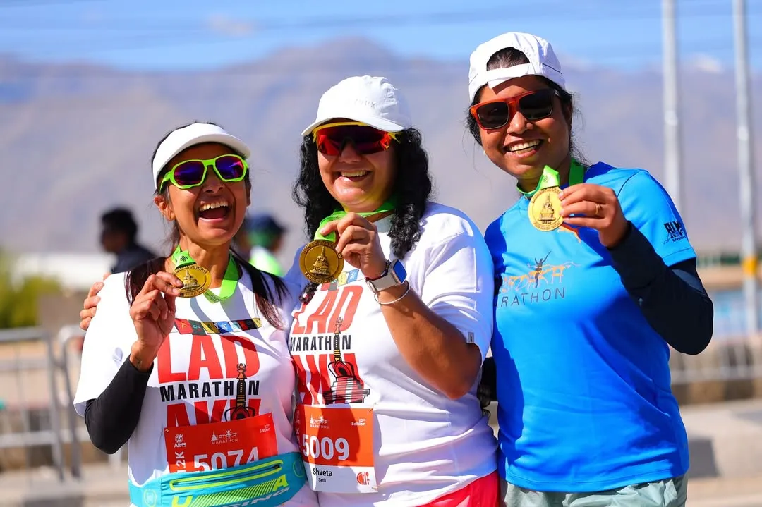 The pure joy of achievement. Three members of our team proudly show off their finisher medals after conquering the Ladakh Marathon, smiles all around. This is the moment all the hard work pays for.