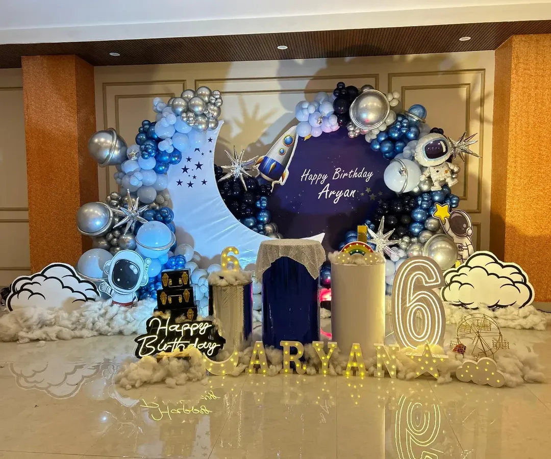 For the little astronaut, this outer space theme is a blast! I created a complete galaxy experience with a crescent moon backdrop, planet and rocket balloons, astronaut cutouts, and cloud-like floor decor to make Aryan's 6th birthday truly out of this world.