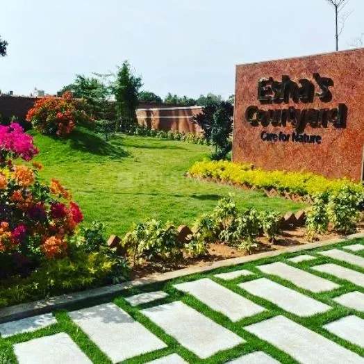 This is the entrance to a residential layout on Sarjapura road that we landscaped. We focused on creating a welcoming and impressive green space with rolling lawns, colorful bougainvillea, and neat stone pathways with grass inlays.