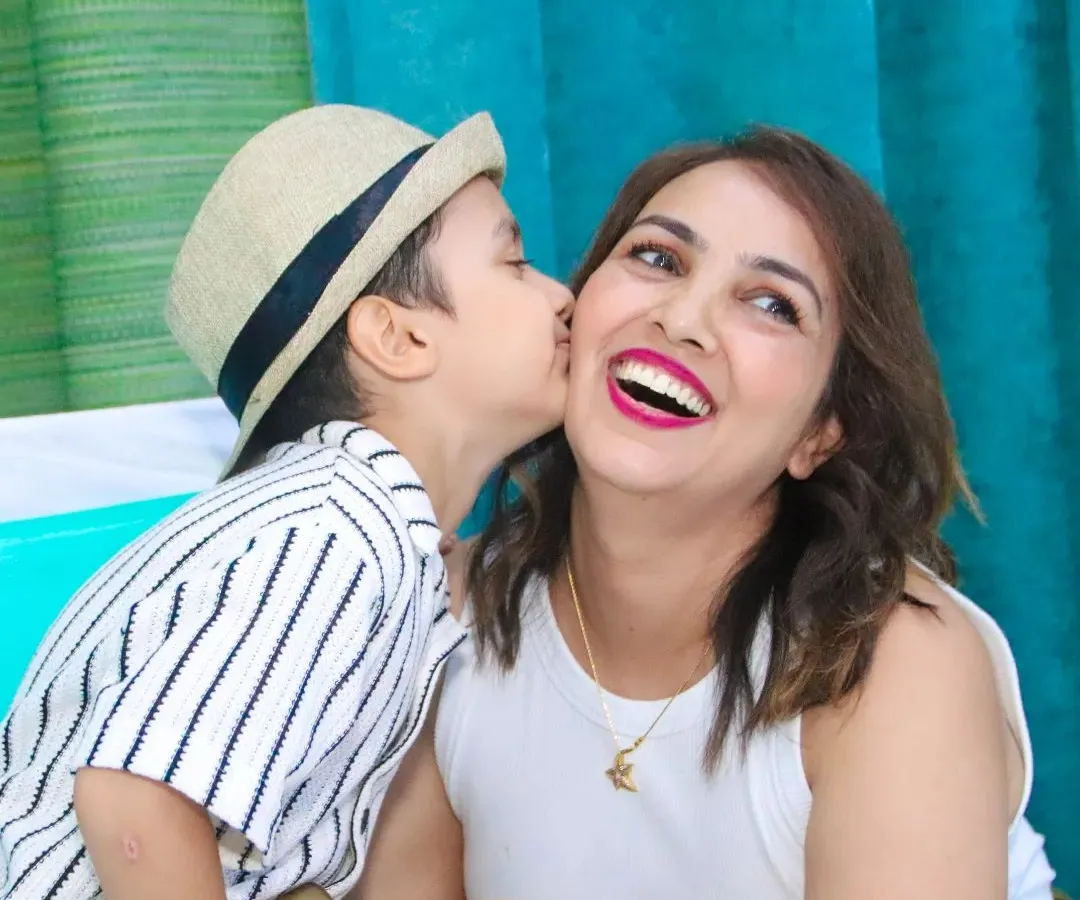 A candid, heartwarming moment between a mother and her son. We focus on capturing these genuine interactions and expressions of love that make your event photos truly special.