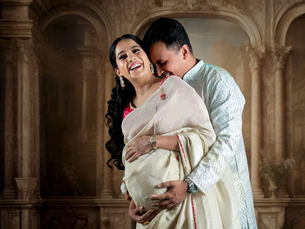 We love capturing the connection between partners. This candid moment was taken in our studio, showcasing how we can create a warm, intimate atmosphere for a traditional maternity photoshoot with a classic, painterly backdrop.