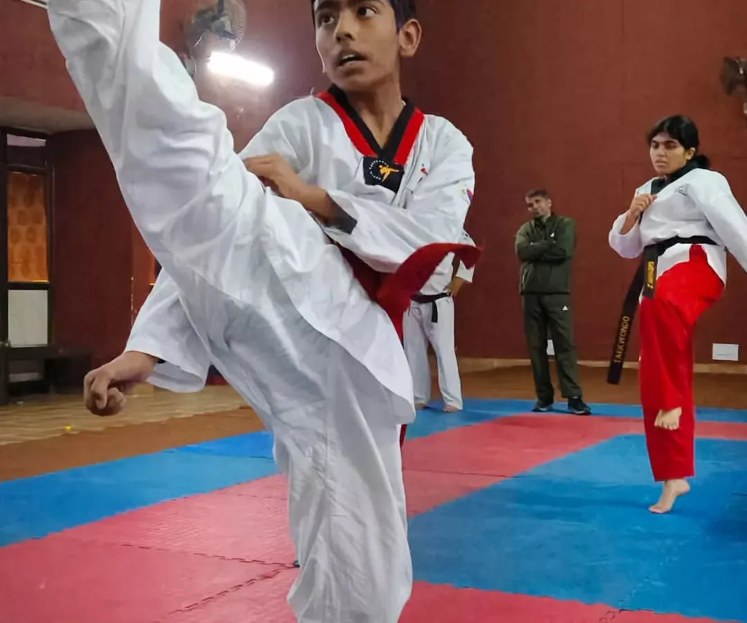 Here's one of my dedicated students demonstrating a perfect high kick. We focus on clean Taekwondo technique and form from day one.