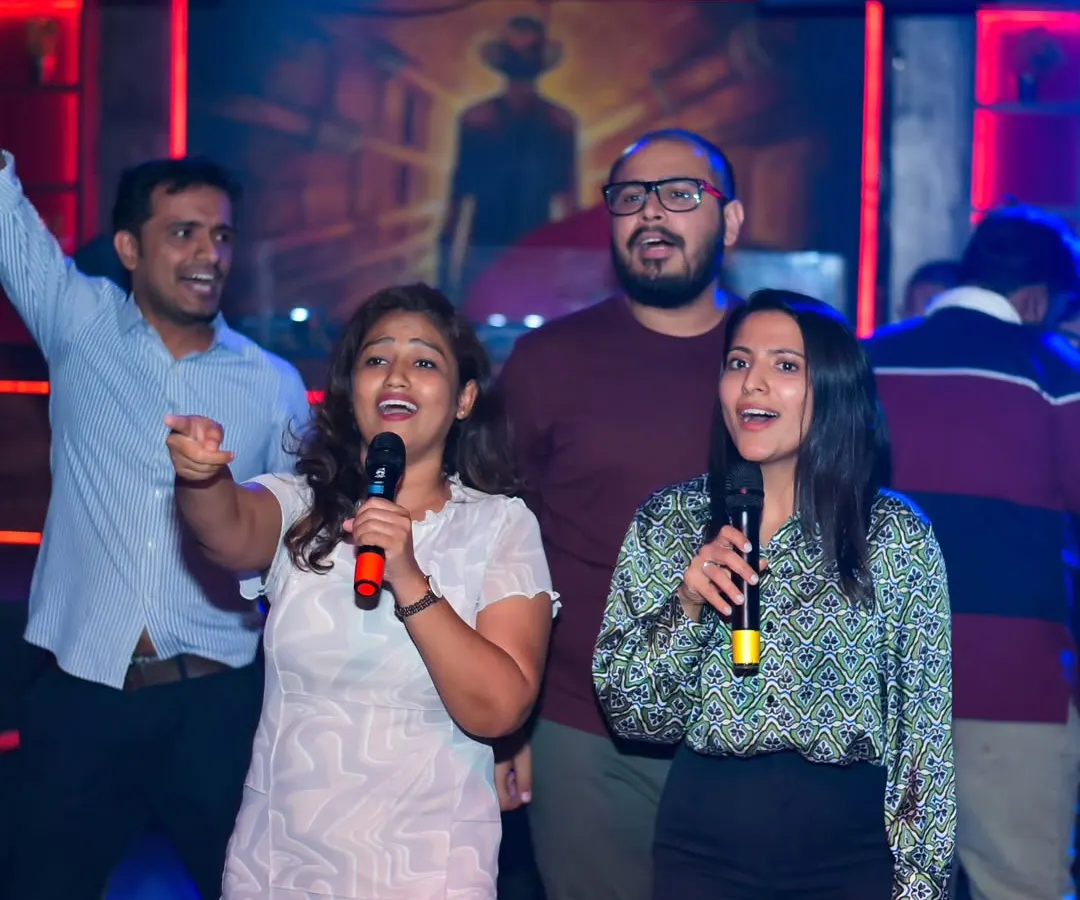 This is what it's all about. A group of friends sharing a mic, singing their favorite song together. My karaoke nights are designed to bring people together and create these moments of pure joy and connection.