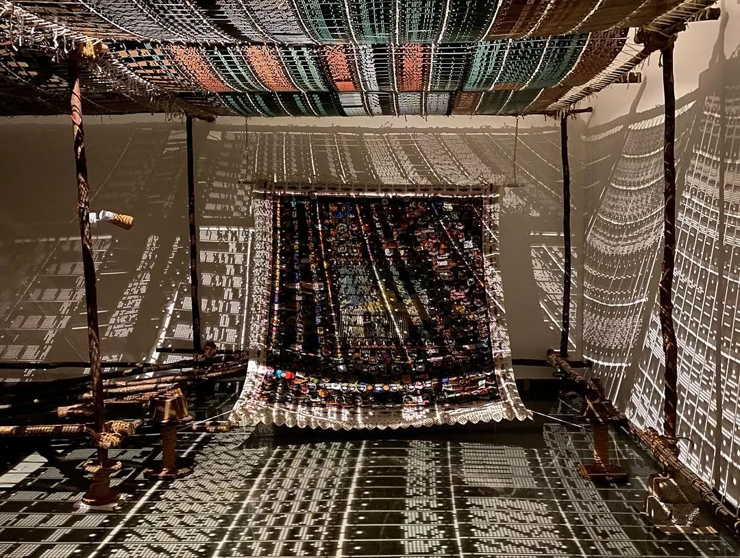 An immersive installation from Archana Hande's 'WEAVING LIGHT'. I believe in transforming spaces. Here, we used light and shadow projected through traditional jacquard loom punch cards to create a magical, shifting landscape that tells a story of craft and technology.