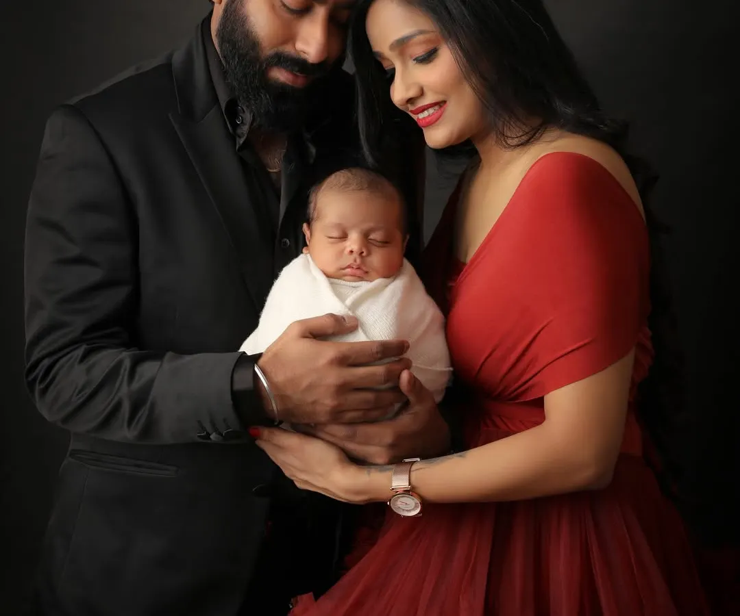 The journey comes full circle. This is that precious moment when parents hold their newborn for the first time in a family portrait. I used a dramatic, dark backdrop to draw all the focus to their connection and the beautiful details of their baby.