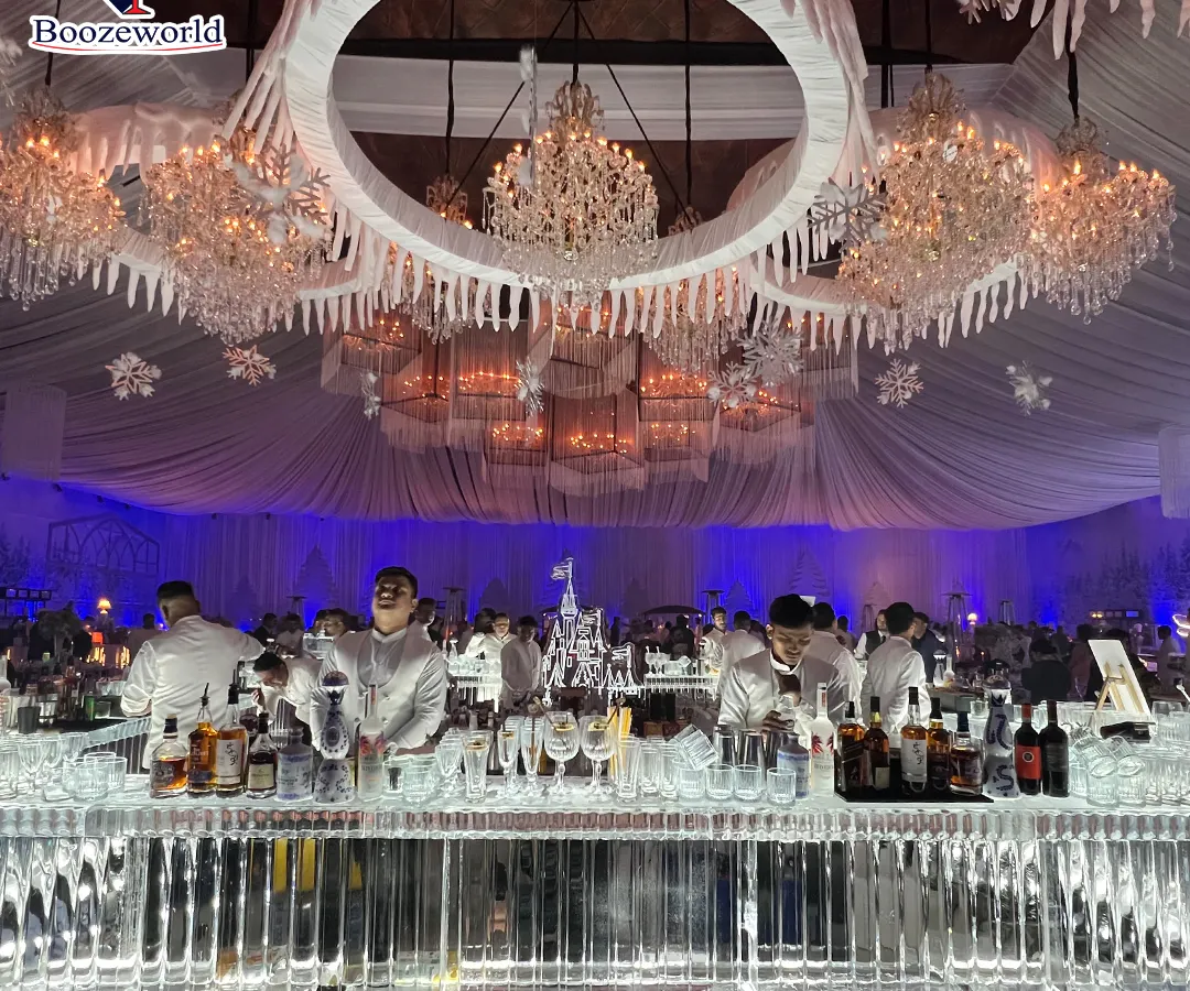 This is how we bring a winter wonderland to life. For this grand wedding, we constructed a complete ice bar, including intricate sculptures and custom lighting, that served as a breathtaking centerpiece. We can design and build thematic bars of any scale to create an immersive experience for your guests.