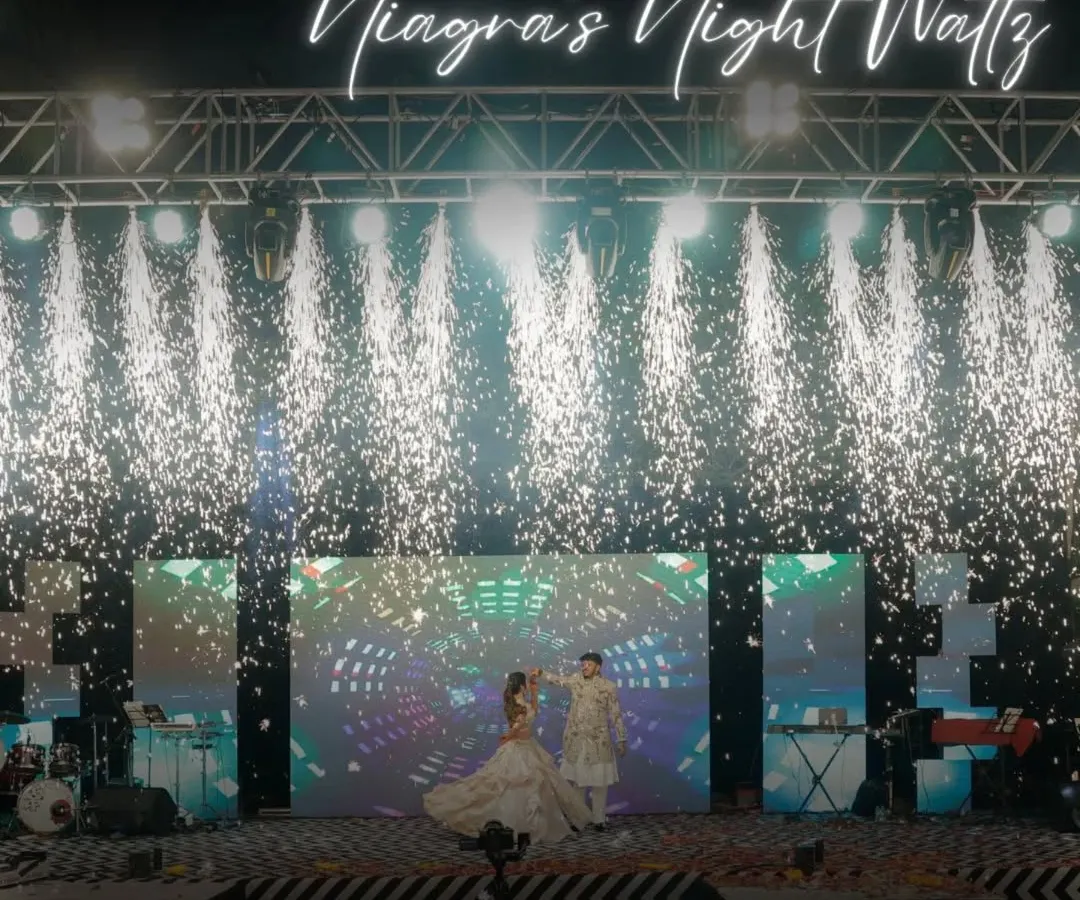 This is what a Sangeet masterpiece looks like. We designed and executed this spectacular stage, complete with a waterfall of pyrotechnics, to create a night of pure cinematic magic for the couple's first dance.