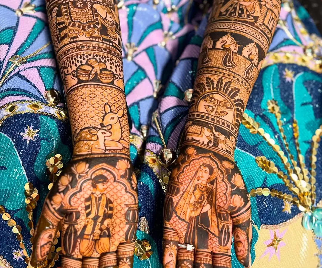 A close-up of a full bridal mehendi design, showcasing the incredible detail that goes into my work. This piece features classic bride and groom figures, a doli (palanquin), and even a deer, telling a complete wedding story on the arms.