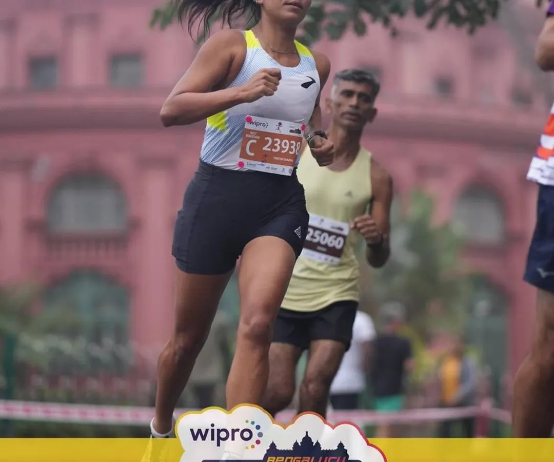 Mid-race focus during the Bengaluru Half Marathon. Performance isn't just about physical strength; it's about mental toughness. I coach my athletes to build resilience so they can push through the tough moments and execute their race plan.