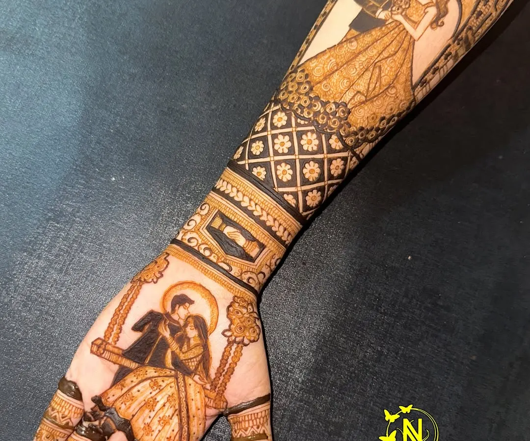 I love creating both modern and traditional looks. This design features a romantic couple on a swing on the palm, complemented by a contemporary portrait on the forearm, showing how we can blend different styles for a full bridal look.
