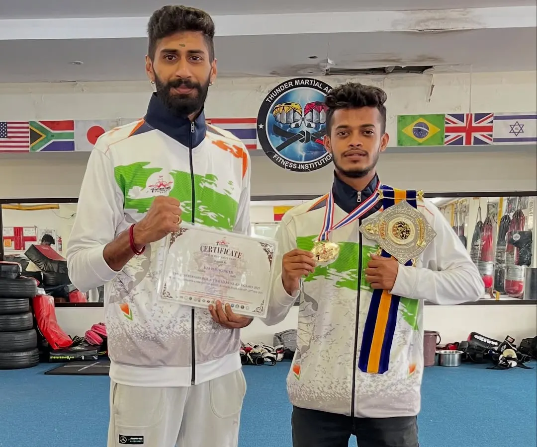 My focus is simple: my student becomes the champ. Here is my fighter with his title belt and gold medal from the 7th International Thai Martial Arts competition in Bangkok. This is the result of our hard work.