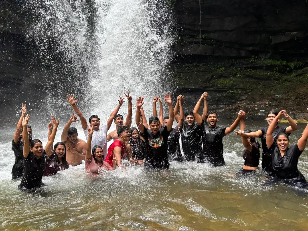 It’s not just about the climb, it’s about the celebration. Here’s one of my groups cooling off and having a blast in a natural waterfall pool during a monsoon trek. I make sure my trips are packed with these moments of pure fun.