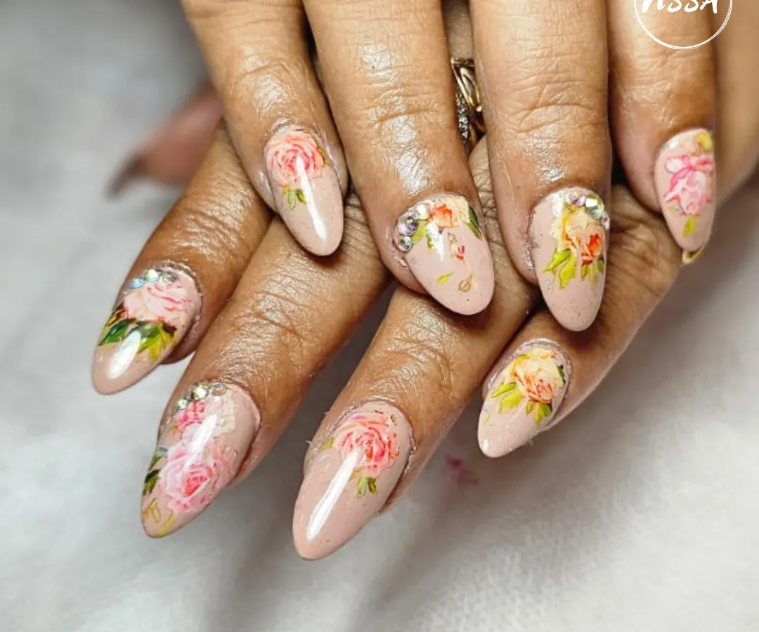 A perfect example of elegance. This hand-painted floral design on a neutral base is a client favorite. It’s subtle, sophisticated, and showcases the delicate brushwork that goes into creating timeless nail art.