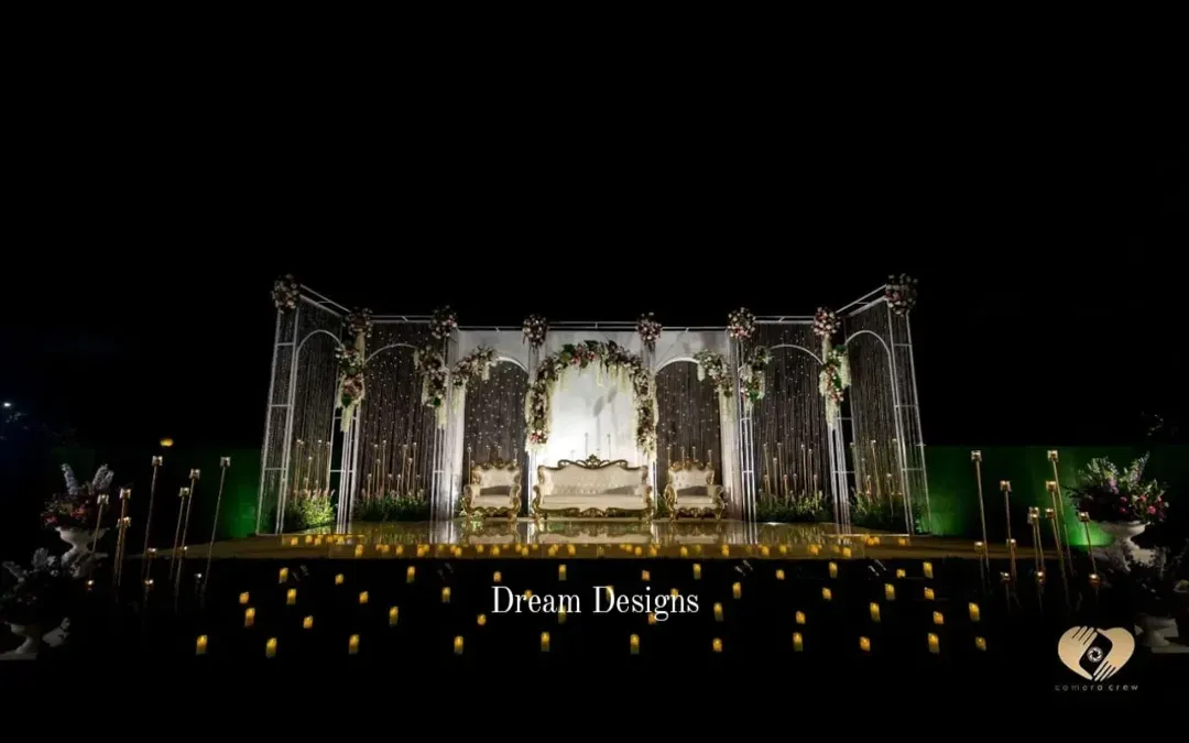 For the reception, I love creating a dramatic "wow" moment. This magnificent stage combines architectural arches, shimmering crystal curtains, and a candlelit mirrored floor to produce a truly unforgettable, high-impact setting for the evening's celebration.