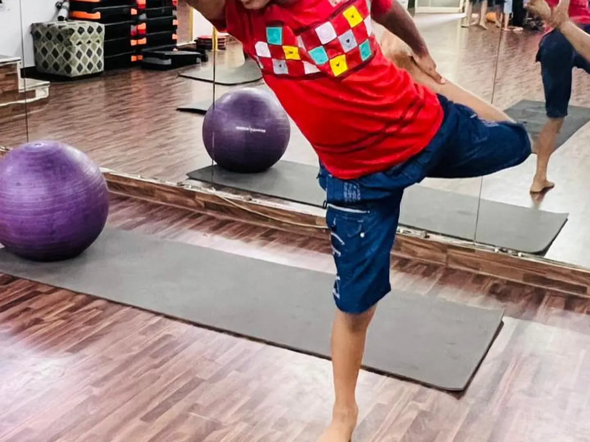 It's never too early to start a yoga journey. In our kids' yoga classes, we help children build strength and concentration in a fun way, like with this challenging balancing asana.