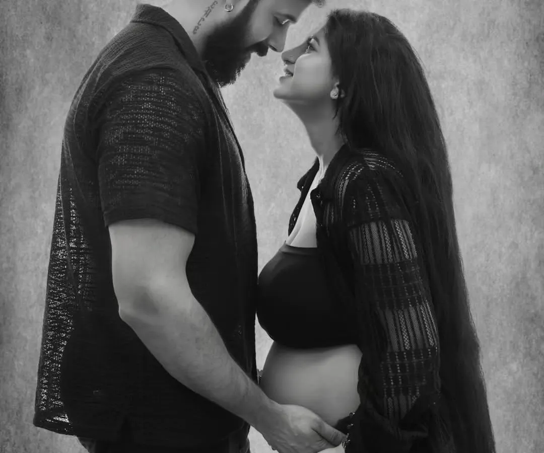 There is a unique connection between a couple as they await their child. I focus on capturing that raw emotion and anticipation in timeless black and white couple portraits.