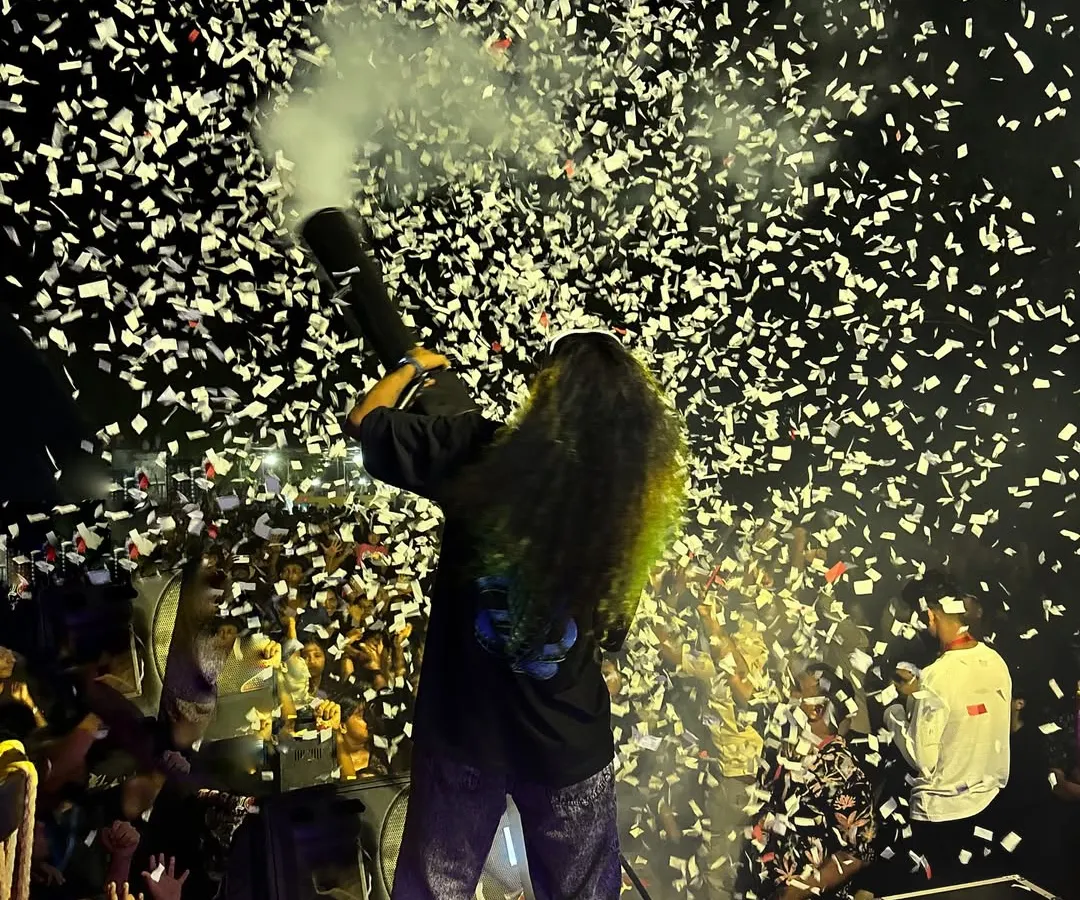 There is no better feeling than connecting with the crowd. Here I am, firing a confetti cannon over a massive audience, creating a moment of pure celebration and energy that defines my shows.