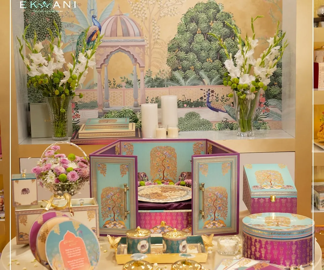 Here is a complete view of the Tree of Life collection, a vibrant suite designed to celebrate new beginnings. It includes the central hamper, coordinated gift boxes, stationery, and artisanal jars, all tied together with motifs of peacocks and elephants for a cohesive and meaningful story.