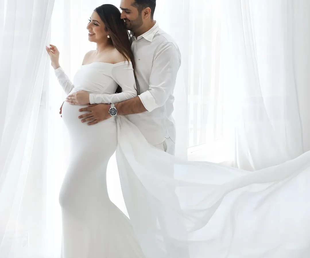 Your partner is a huge part of this journey, and capturing your connection is pure magic. This moment, with the light wrapping around you both in flowing white, is about the shared dream you're building together.