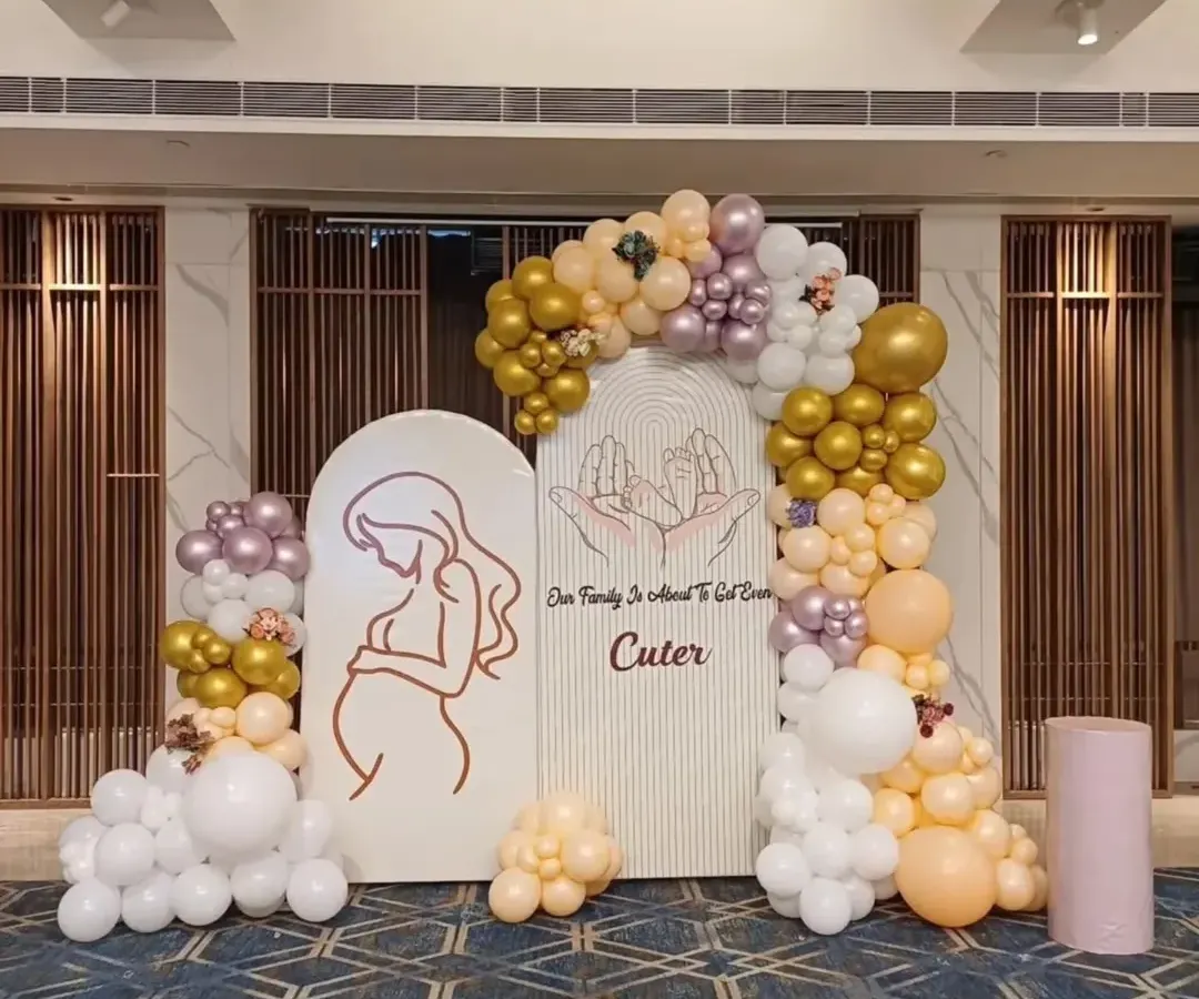 For this baby shower, I created an elegant and modern backdrop using arched panels and a custom organic balloon garland. The soft colors and clean lines are perfect for a sophisticated celebration for the mom-to-be.