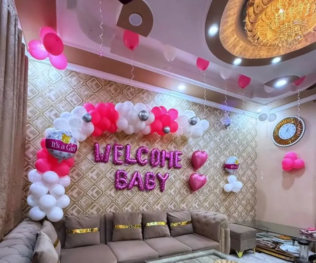 Welcoming a new baby girl with this cheerful home decoration. I used a custom balloon arrangement in pink, white, and silver, complete with "Welcome Baby" foil letters, to create a joyful and loving atmosphere for the family's special moment.