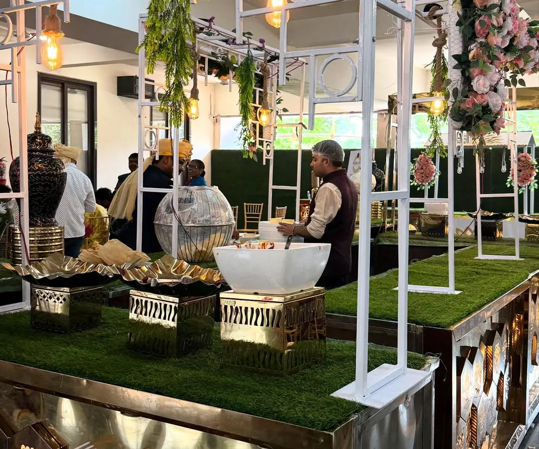 This is one of my modern buffet setups, designed with a clean white frame, elegant florals, and gold accents to create a grand first impression for your event guests.