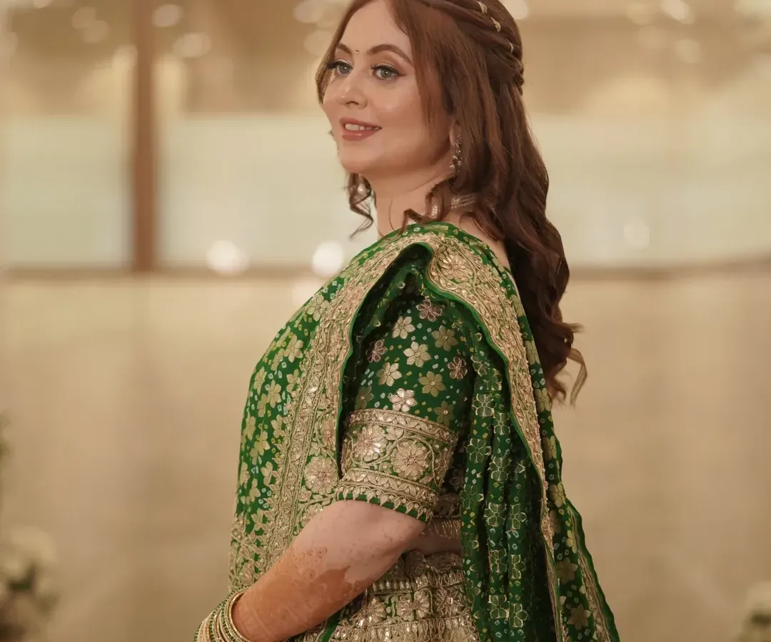 A candid moment of pure happiness from an engagement celebration. I created this soft glam look with radiant skin and gentle contouring to complement her beautiful green lehenga, ensuring she looked and felt effortlessly elegant.
