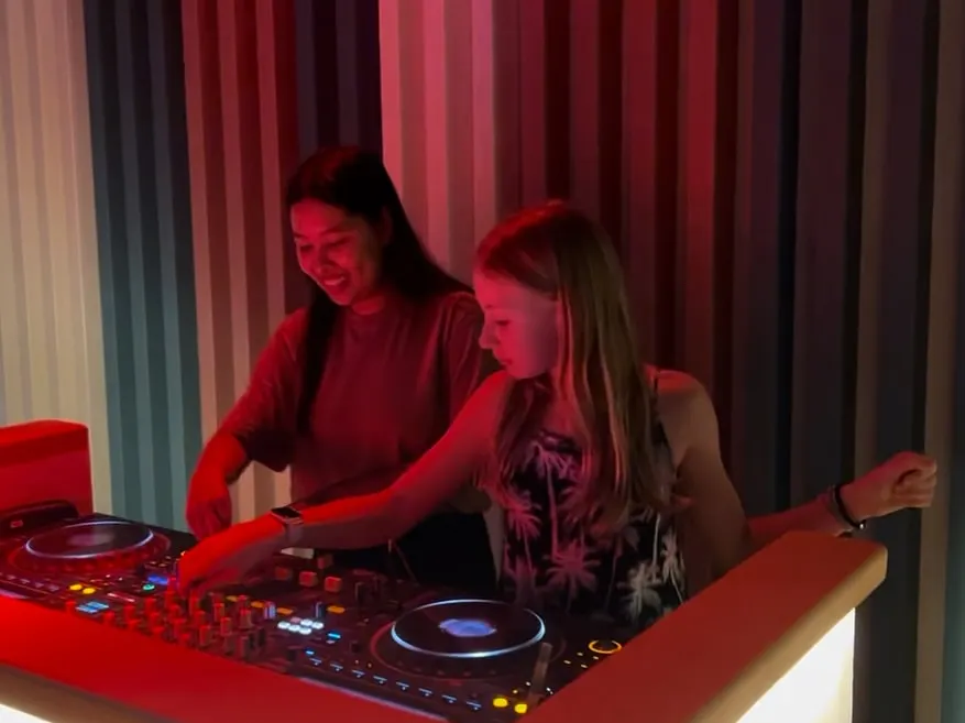 The best moments are when it just clicks. Here I am guiding a student from the UK through her first beat-matching session. My lessons are always one on one, so we can focus on your pace and your sound, making sure you feel the music.