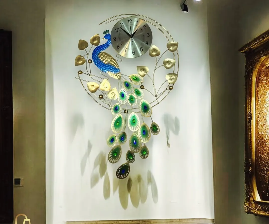 Our peacock wall clock is a vibrant example of functional art. The handcrafted metalwork combines rich blues and greens with golden accents, creating a stunning focal point that is both a timepiece and a majestic sculpture.